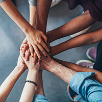 Multicultural Hands Extended out into a Circle