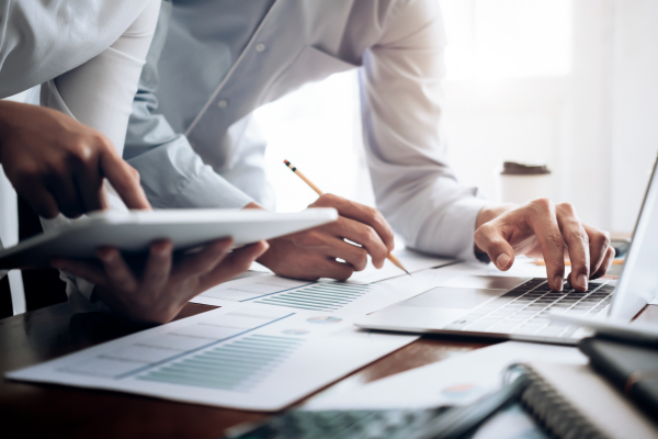 business transactions with paper and computer