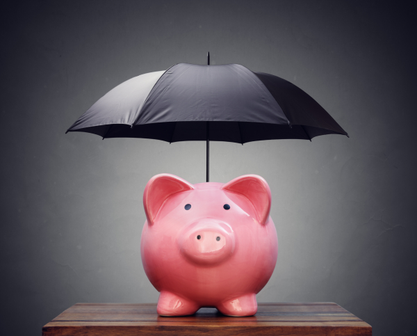 piggy bank with umbrella over it